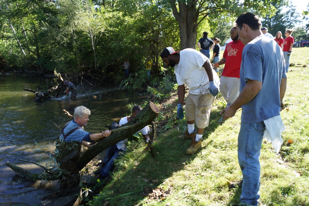 Volunteers clearing a log jam in the Clinton River